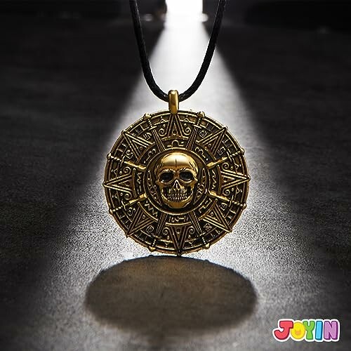 Gold pirate skull medallion pendant on dark background